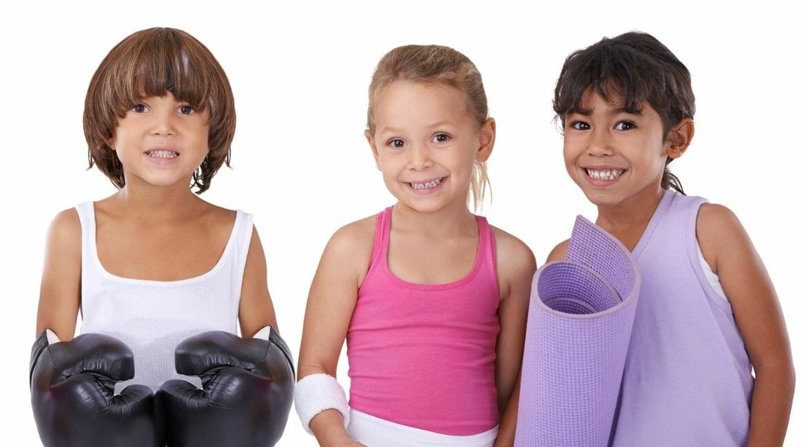 Three Young Children Enjoying Homeschool Pe With Fun And Fit Boxing Gloves.
